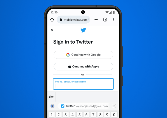 Zoomed-in Android phone displaying a “Sign in to Twitter” page, with the 1Password icon displayed just above the keyboard, next to an inline login suggestion allowing for one-tap sign-in.